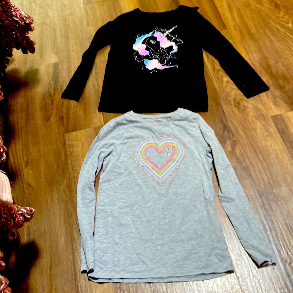 Black top with unicorn and grey colorful top with hearts